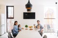 Portrait of happy family having breakfast together at home on modern and stylish kitchen Royalty Free Stock Photo