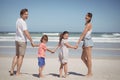 Portrait of happy family holding hands at beach Royalty Free Stock Photo