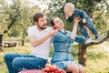 Portrait of Happy family hugging and spending time together outside in green nature. Royalty Free Stock Photo