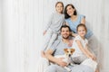 Portrait of happy family indoor. Handsome father holds dog, beau Royalty Free Stock Photo