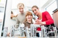 Portrait of a happy family looking for a new bathroom sink faucet Royalty Free Stock Photo