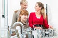 Portrait of a happy family looking for a new bathroom sink faucet Royalty Free Stock Photo