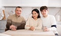 Portrait of happy family - married couple and father at home Royalty Free Stock Photo