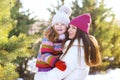 Portrait of a happy family, mother with child having fun in the winter Royalty Free Stock Photo