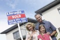 Portrait Of Happy Family Outside New Home Royalty Free Stock Photo