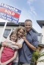 Portrait Of Happy Family Outside New Home Royalty Free Stock Photo