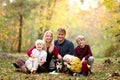 Portrait of Happy Family of Mother and Father and their Cute Smiling Children and Their Pet Dog Outside Royalty Free Stock Photo