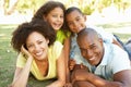 Portrait of Happy Family Piled Up In Park Royalty Free Stock Photo