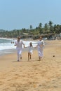 Portrait of happy family running on a beach Royalty Free Stock Photo