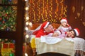 Portrait of a happy family in santa claus hats