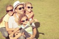 Portrait a happy family sitting on the grass Royalty Free Stock Photo