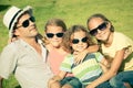 Portrait a happy family sitting on the grass Royalty Free Stock Photo