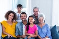 Portrait of happy family sitting together on sofa Royalty Free Stock Photo