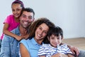 Portrait of happy family sitting together on sofa Royalty Free Stock Photo