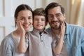 Portrait of happy family with small boy child