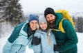Portrait of happy family with small daughter looking at camera outdoors in winter nature, Tatra mountains Slovakia. Royalty Free Stock Photo
