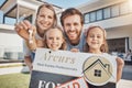 Portrait of happy family, sold sign or home keys for moving into a new house with mom, dad or kids. Smile, success or Royalty Free Stock Photo