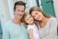 Portrait of a happy family standing on front of their new house Royalty Free Stock Photo