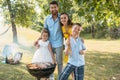 Portrait of happy family with two children standing outdoors Royalty Free Stock Photo