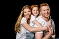 Portrait of happy family in white t-shirts hugging each other Royalty Free Stock Photo