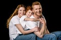 Portrait of happy family in white t-shirts hugging each other Royalty Free Stock Photo