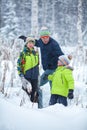 Portrait of a happy family in winter park. Father, son and little daughter laughing Royalty Free Stock Photo