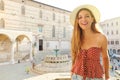 Portrait of happy fashion girl traveling in Italy. Beautiful woman visiting the old medieval city of Perugia, Italy Royalty Free Stock Photo