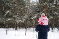 Portrait of happy father and baby toddler daughter on winter nature background. Man and baby girl on his shoulders in Royalty Free Stock Photo