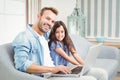 Portrait of happy father and daughter using laptop Royalty Free Stock Photo