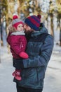 Portrait of happy father and daughter in the winter forest Royalty Free Stock Photo