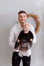 Portrait of happy father and his adorable little daughter on his hands at home. Happy childhood. dad is hugging his baby Royalty Free Stock Photo