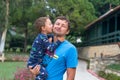 Portrait of a happy father with his little son on vacation. Little boy kisses and hugs his father. Happy fathers day.Happy family. Royalty Free Stock Photo