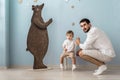 Portrait happy father with little son, looking at camera, handsome dad and cute baby boy child posing together for family photo Royalty Free Stock Photo