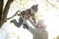 Portrait of happy father with son in autumn park Royalty Free Stock Photo
