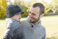 Portrait of happy father son in autumn park Royalty Free Stock Photo