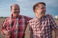 Portrait of happy father and son walking outdoors. Royalty Free Stock Photo