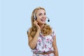 Portrait of happy female call center worker wearing headset. Royalty Free Stock Photo