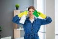 Portrait of happy female cleaner with cleaning equipment in office Royalty Free Stock Photo