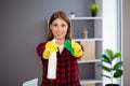 Portrait of happy female cleaner with cleaning equipment in office Royalty Free Stock Photo