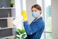 Portrait of happy female cleaner with cleaning equipment in office Royalty Free Stock Photo