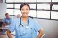 Portrait of happy female doctor smiling in conference room Royalty Free Stock Photo