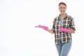 Portrait of happy female doing house duties wearing rubber gloves and holding cleaning equipment. Cheerful look. Hygiene, cleaning Royalty Free Stock Photo