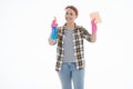 Portrait of happy female doing house duties wearing rubber gloves and holding cleaning equipment. Cheerful look. Hygiene, cleaning