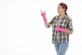 Portrait of happy female doing house duties wearing rubber gloves and holding cleaning equipment. Cheerful look. Hygiene, cleaning Royalty Free Stock Photo