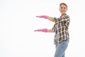 Portrait of happy female doing house duties wearing rubber gloves and holding cleaning equipment. Cheerful look. Hygiene, cleaning Royalty Free Stock Photo