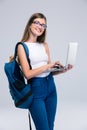 Portrait of a happy female teenager using laptop Royalty Free Stock Photo