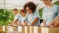 Portrait of a Happy Female Volunteer Preparing Free Food Delivery for Low Income People. Charity Royalty Free Stock Photo