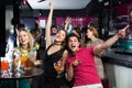 Portrait of happy females and males in the bar Royalty Free Stock Photo