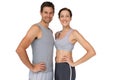 Portrait of a happy fit couple with hands on hips Royalty Free Stock Photo