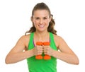 Portrait of happy fitness young woman with dumbbells Royalty Free Stock Photo